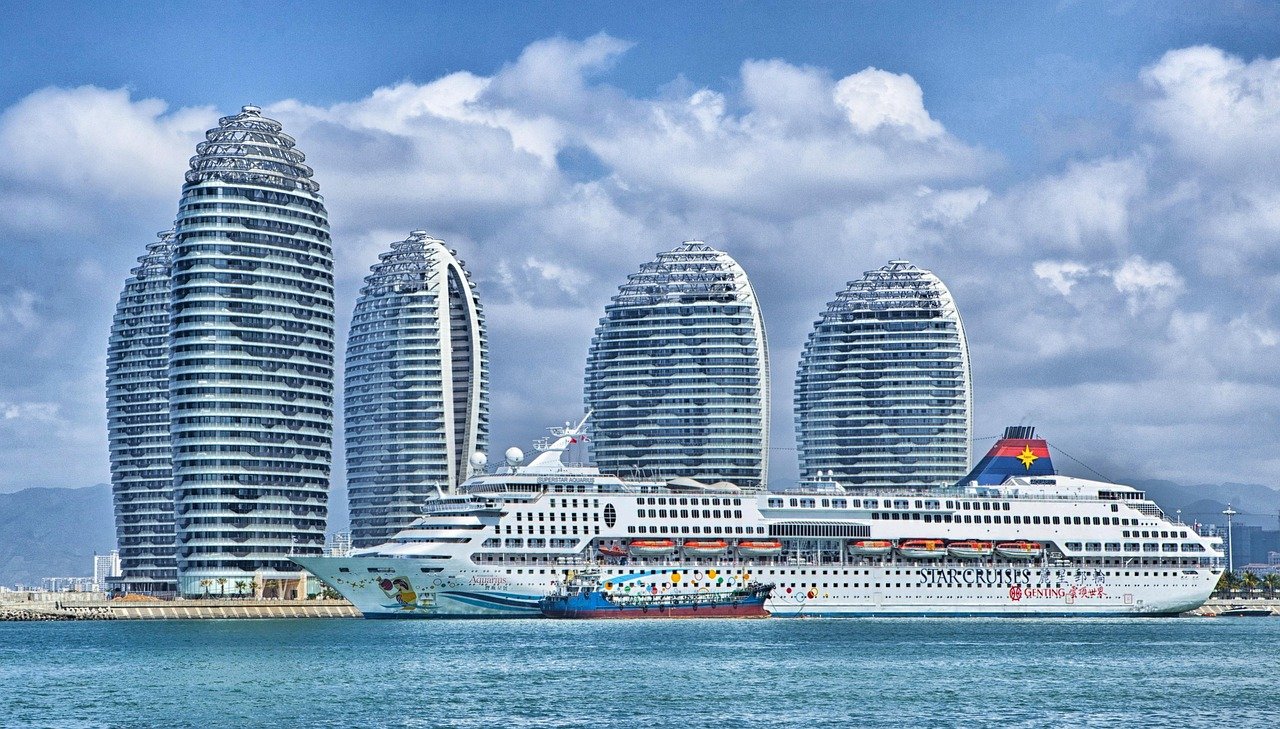 ship, city, nature, harbor, port, bay, water, skyscrapers, hotels, modern buildings, buildings, island, phoenix island, urban, skyline, ocean liner, passenger ship, cruise ship, superstar aquarius, sanya bay, hainan, china